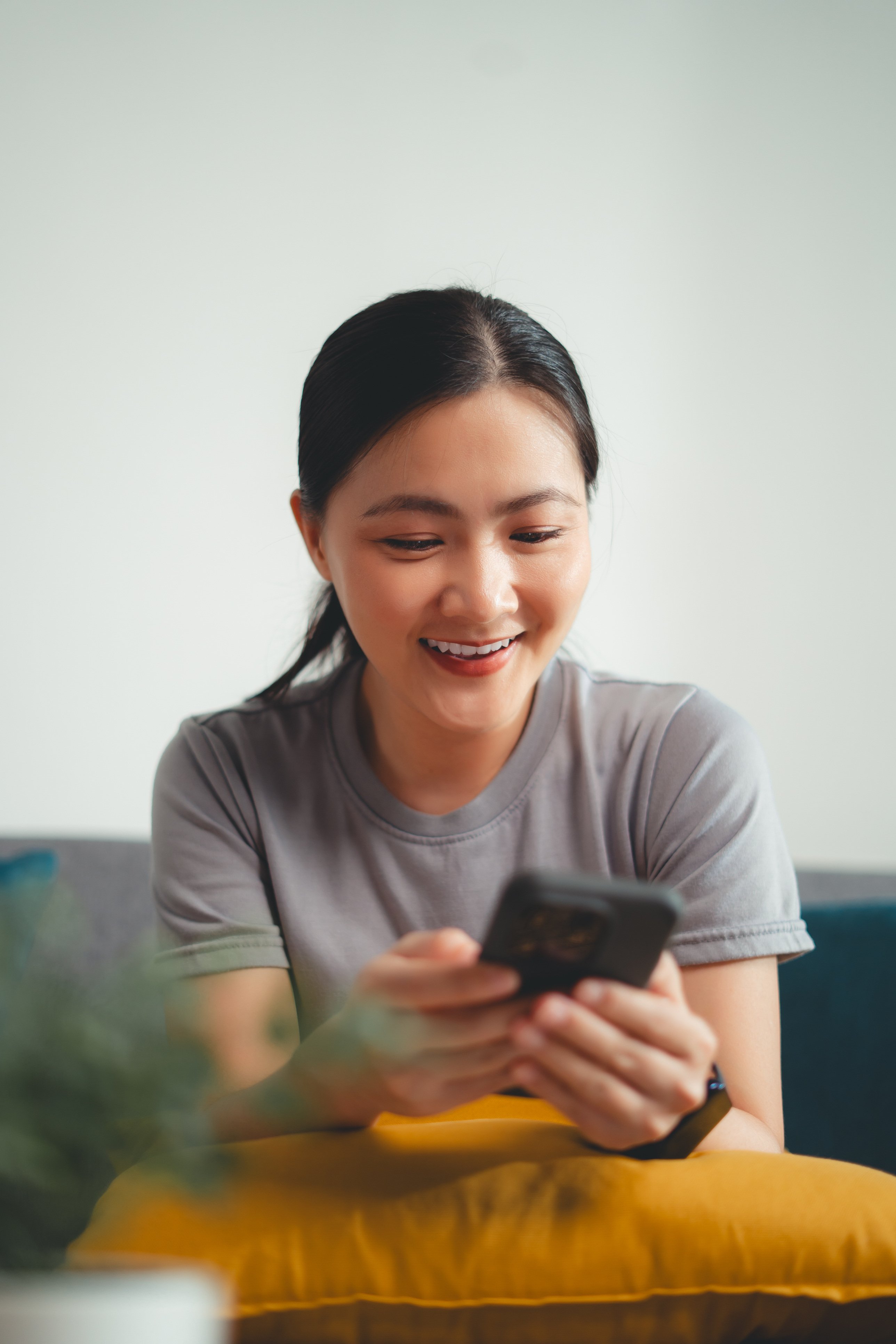 Request a Proposal woman smiling at phone