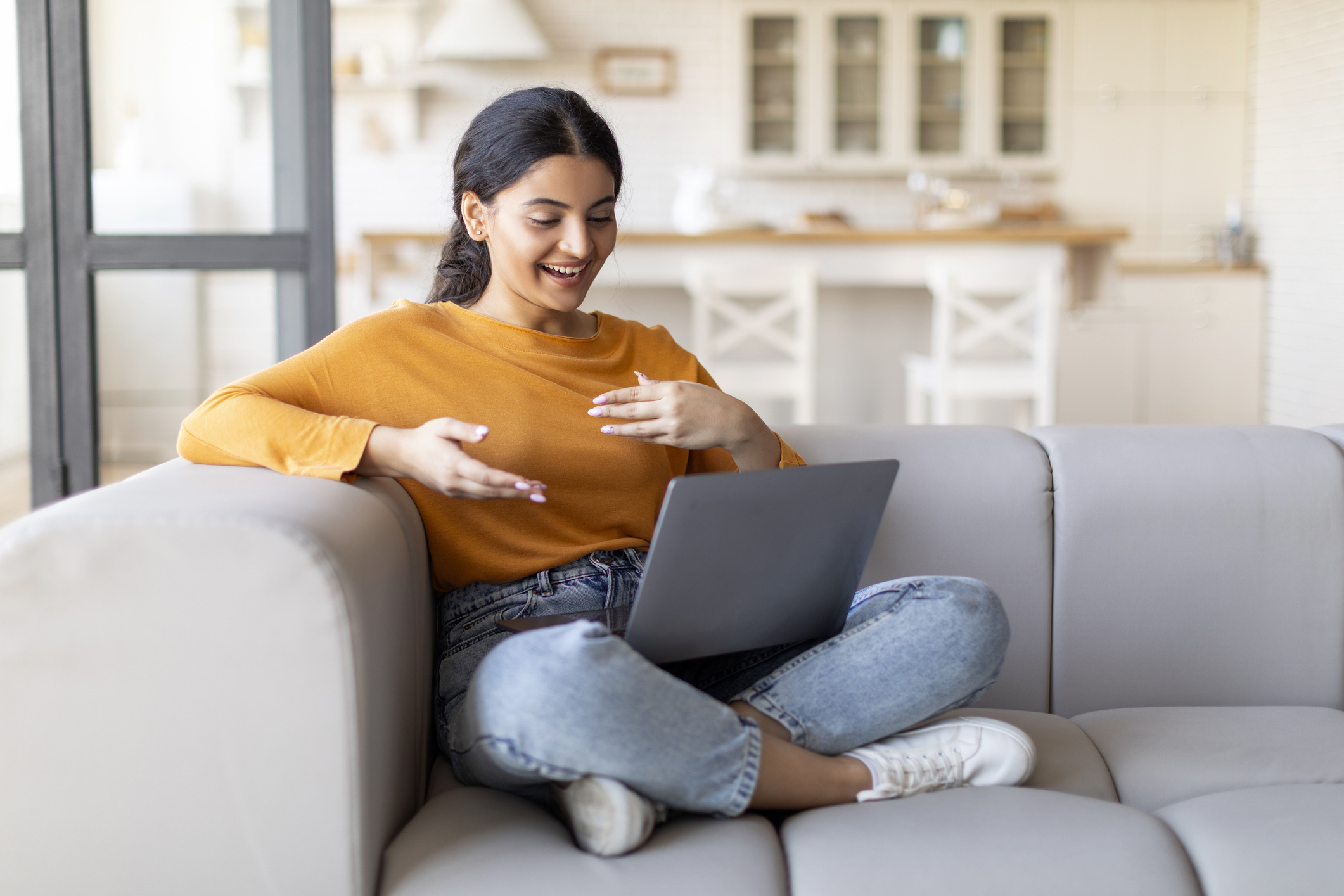 Person Smiling at Computer