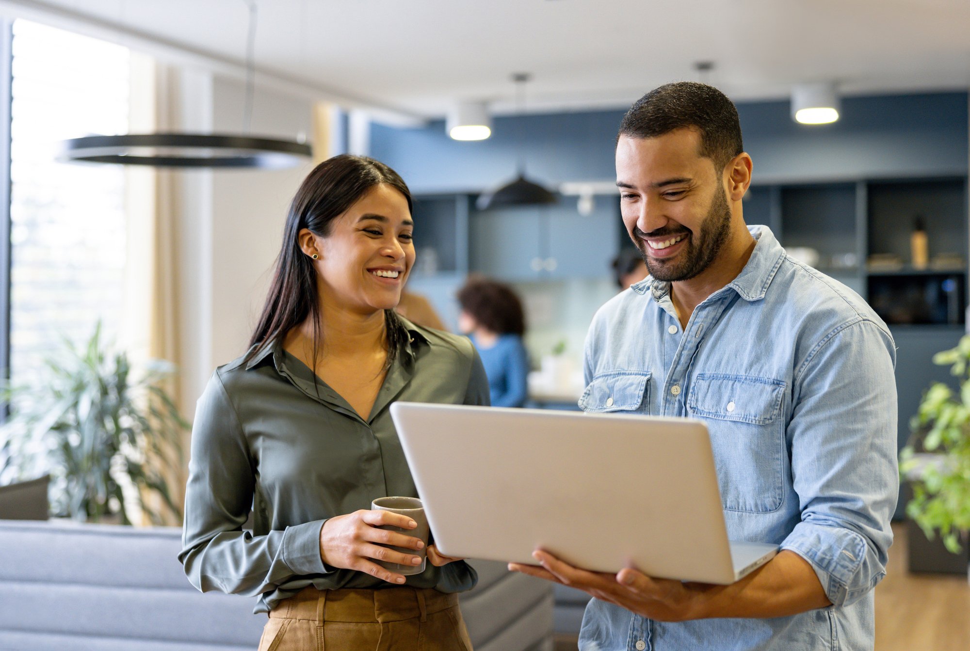 people smiling at computer